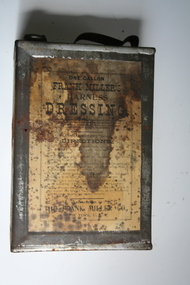 Tin can containing harness dressing for equine use
