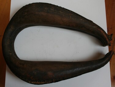 Brown leather oval shaped horse collar
