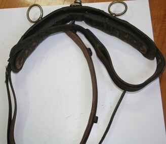Used on horses pulling carts agricultural equipment to direct reins to bit in the mouth
