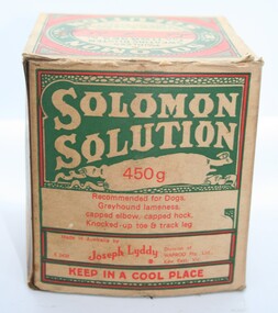 Cardboard box containing glass jar of Solomons solution for dogs
