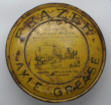 Squat round yellow painted tin containing Frazers axle grease