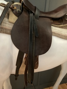 Brown leather basic military style saddle including stirrups