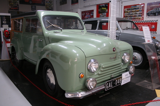 Green 1953 Hartnett two door estate sedan with black vinyl roof and timber window surrounds