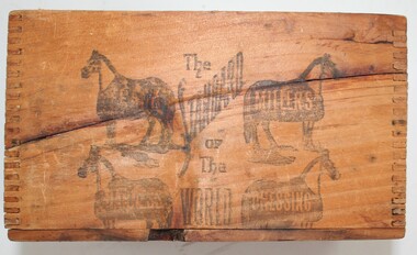 Wooden box with lid with imprints of horses on front.