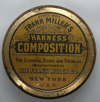 squat circular tin can, yellow lid with contents printed on face.