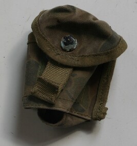 Canvas pouch painted with camouflage print steps to attach to belt