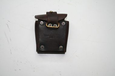 Dark brown ammunition pouch belt loop on rear fastened with studs