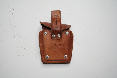 Tan leather pouch with rear facing cover, Belt loop on rear riveted to the pouch.