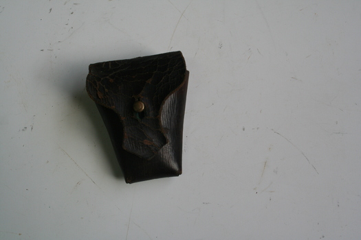 Brown leather bullet pouch designed to be attached to either belt or bandolier