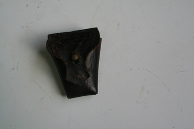 Brown leather bullet pouch designed to be attached to either belt or bandolier