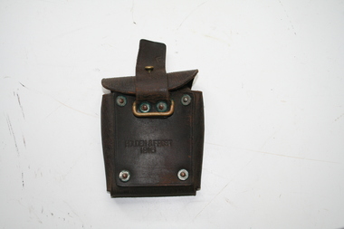 eather pouch for mounting on belt, reverse facing cover with holding strap under cover