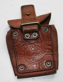 Tan leather pouch designed to carry spare rifle ammunition