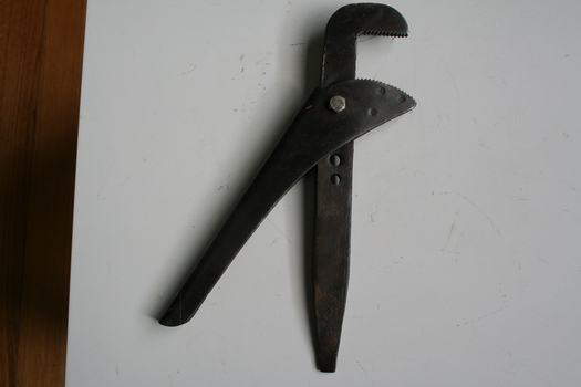 Steel adjustable wrench used in construction and plumbing