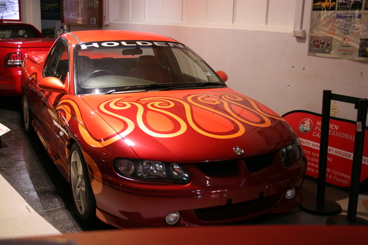 orange painted with gold and burgundy swirls to designate sandman