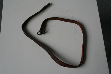 Tan leather strap, part of equestrian bridal