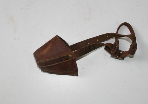 Small brown leather muzzle to fit over dogs nose