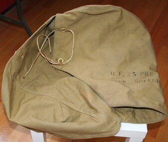 Army green canvas bag to cover the breech of a 25 pound cannon