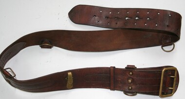 Brown leather waist belt with brass buckle and fittings