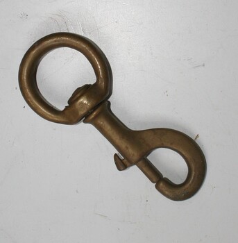 Brass round eyed swivel used in saddlery