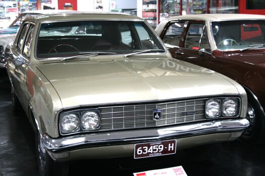 Gold coloured sedan, crome grille and bumpers