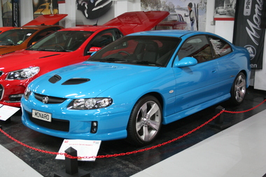 Turismo blue Monaro 2 door VZ8, with black air scoops a feature on the bonnet