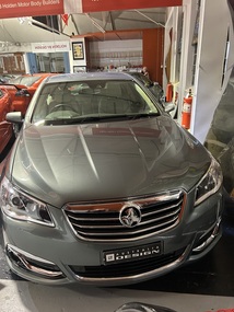 Grey  Holden VF Calais four door sedan, This car was the first car of this model off the production line.