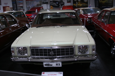 HX four door sedan ,chrome bumper and windscreen surround, rectangular grille with Holden emblem in center