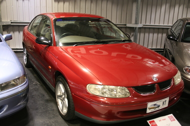 Red coloured 4 door sedan built in 1997