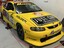 Yellow Holden CV8 racing car