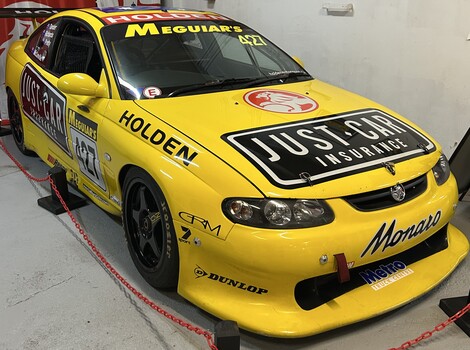 Yellow Holden CV8 racing car