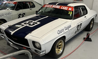 White HQ Monaro Racing Car with black stripe