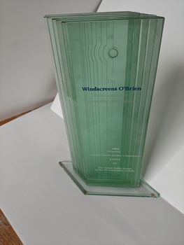 glass trophy on glass mounted base