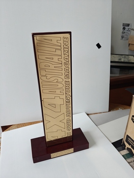 brass plaque on timber stand