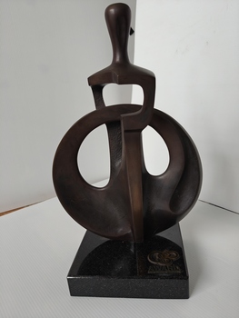 brass trophy on marble stand
