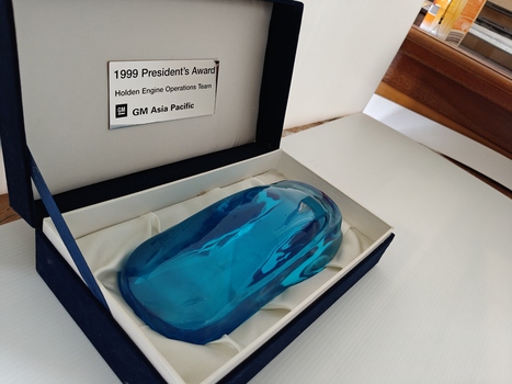 blue acrylic trophy in cardboard presentation box