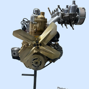 Gold and silver cast steel engine