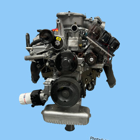 Silver and black V6 motor