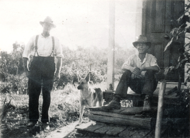 Photograph (sub-item) - Black and White, An orchardist’s family during the 1930’s.  Mr. Walter Heims and son, Harry, sitting on front door step made of sleepers and slats, 1936
