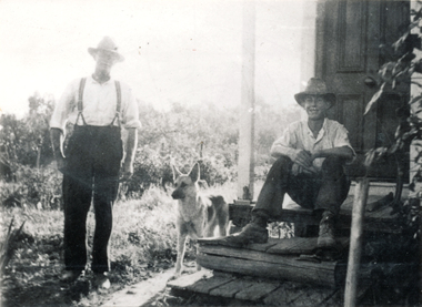 Photograph (sub-item) - Black and White, An orchardist’s family during the 1930’s.  Mr. Walter Heims and son, Harry, sitting on front door step made of sleepers and slats
