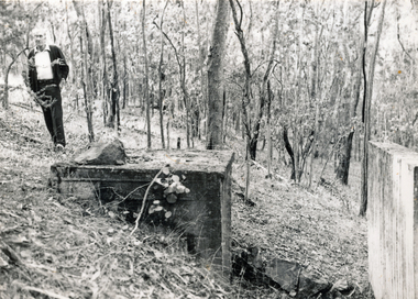 Photograph (sub-item) - Black and White, The remains of the Ammunition Store on Stane Brae, 1984.  During World War II soldiers were trained here.  Mr. Fred Renton on left, c1984