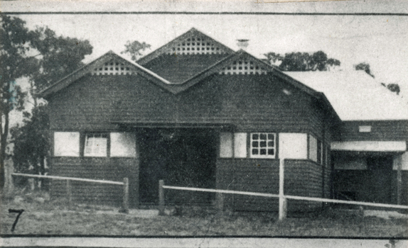 The white roof to the left of the photo is that of the old hall which formed part of the stage and supper room of this hall