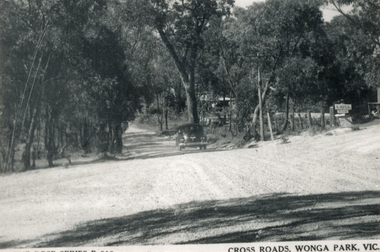Photograph (sub-item) - Black and White, View of the cross-roads at Dudley and Jumping Creek Roads in 1948.  The redbox tree is in front of the car in Dudley Road (still standing in 1985). [The tree has snice died but a high stump remains.)