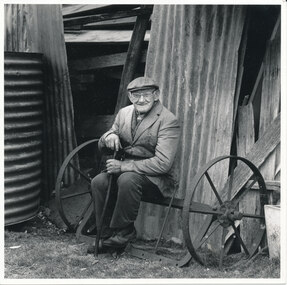 Photograph - Scanned photograph, of W.J. Dawe seated outside derelict corrugated iron shed on his property “Lostwithiel” Dawes Road Wonga Park