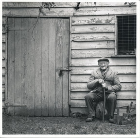 Photograph - Scanned photograph, of W.J. Dawe seated outside weatherboard shed on his property “Lostwithiel” Dawes Road Wonga Park