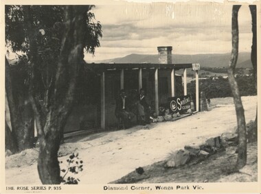 Postcard - with photo “The Rose Series P. 935", "Diamond corner, Wonga Park Vic “Arthur Davis’ cedar train carriage kiosk c. 1948