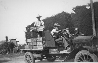 Photograph - Herb in back and Ken Beavis in seat with Bill Cuthill, in T Model Ford truck loaded with peaches c1945