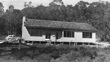 Photograph - Graeme and Jan Beavis' House nearing completion, at Yarra Rd Croydon with Jan standing by the car