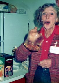Photograph, Lady pouring wine at the Park Orchards Community House