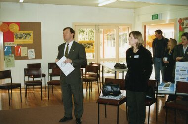 Photograph, Official talking at the Community House (POCH)