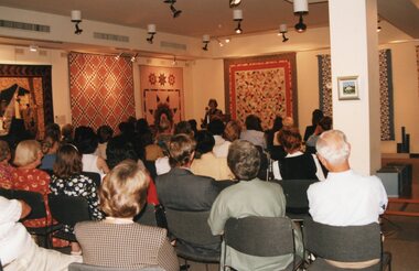 Photograph, Group of people listening to lecture at a gallery
